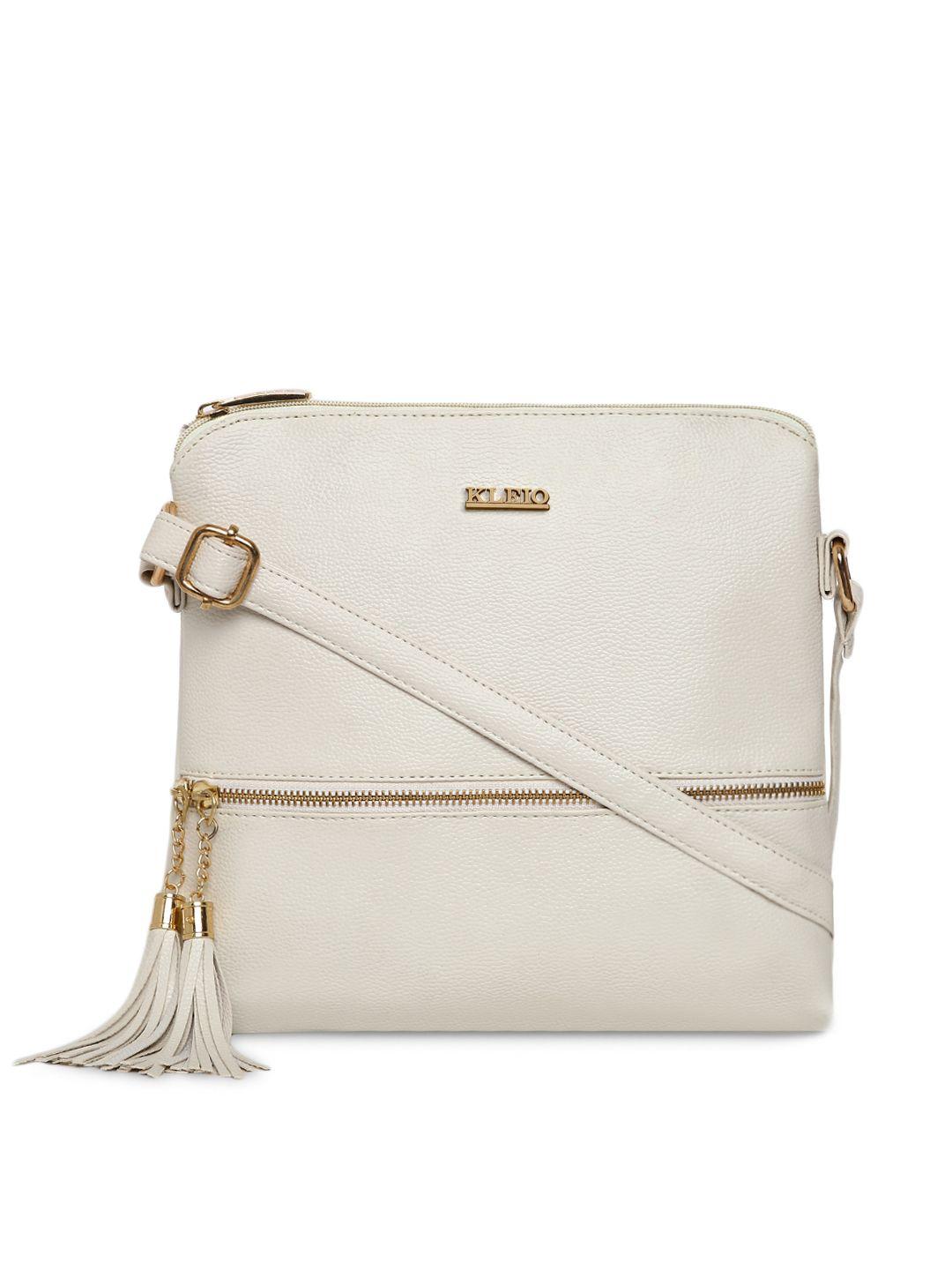 kleio off-white solid tasseled sling bag