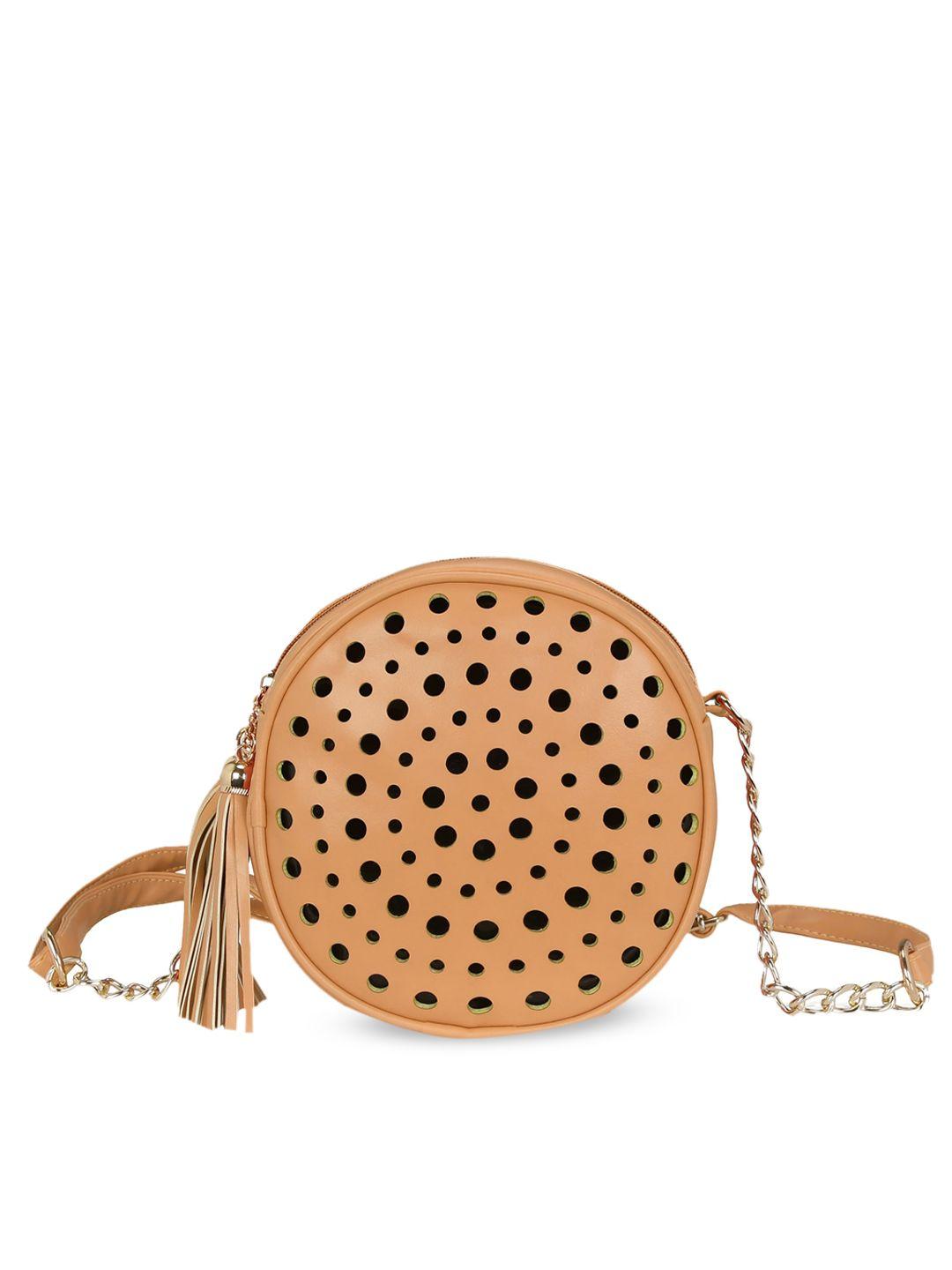 kleio peach-coloured pu structured sling bag with laser cut work