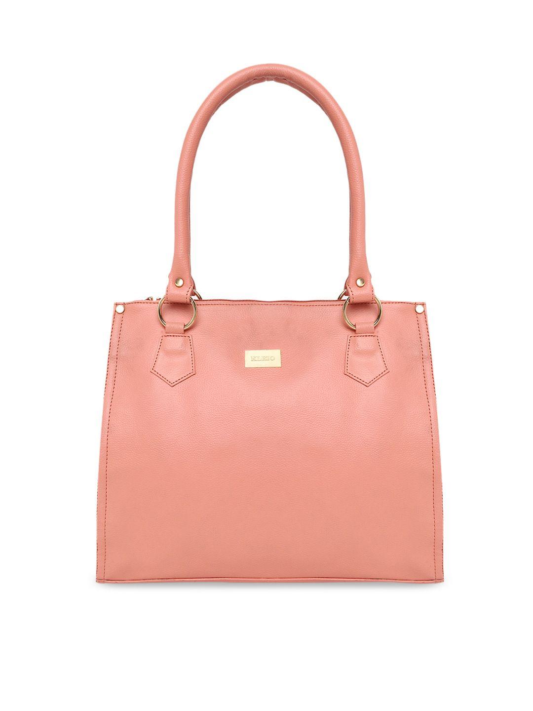 kleio peach-coloured solid handheld bag