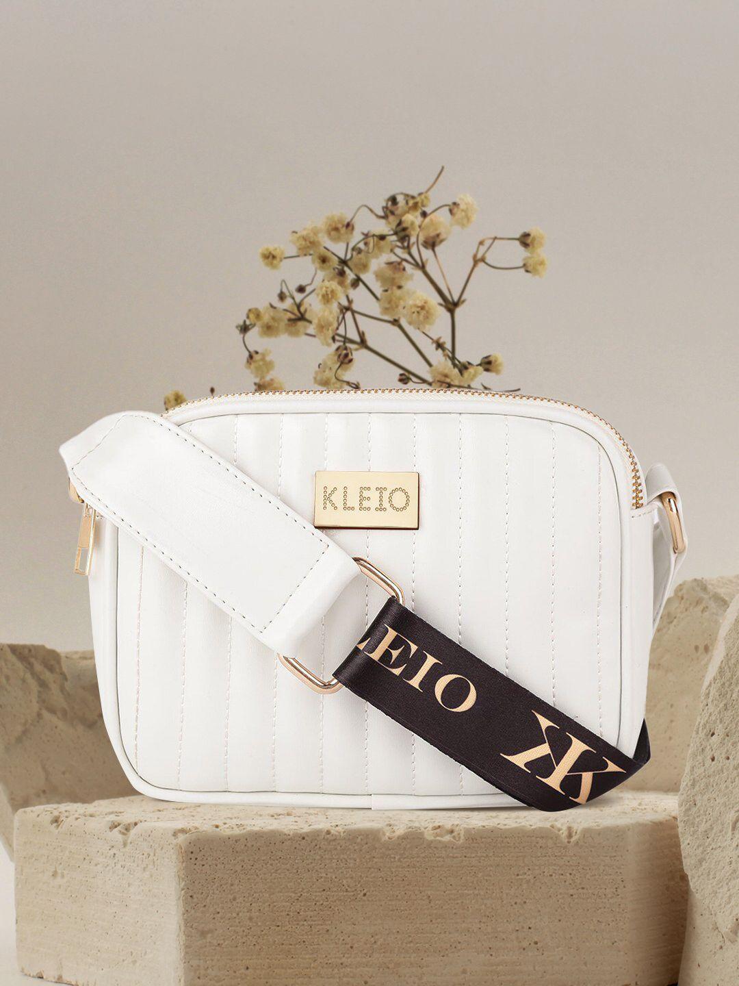 kleio white pu structured sling bag with tasselled