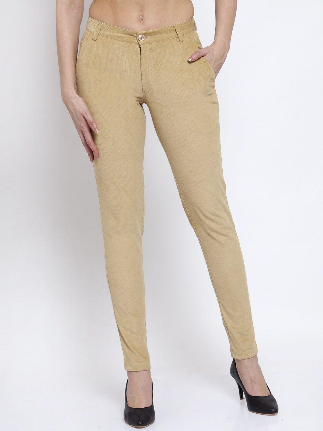 klotthe women beige slim fit solid cotrise fabric trousers