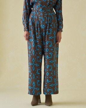 kolam geometric print pleated flared trousers