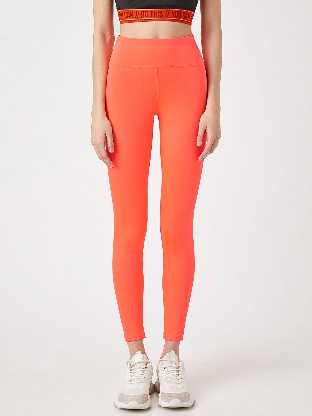 koton women neon orange solid ankle length tights
