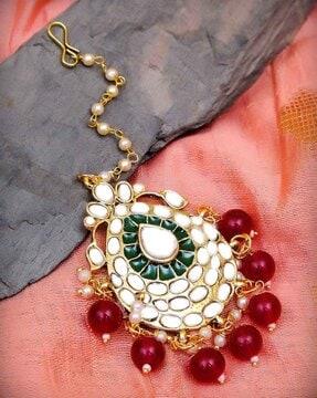 kundan-studded enamel mangtika