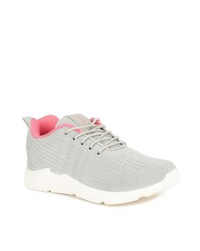 lace fastening sports shoes