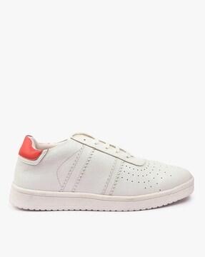 lace-up sports shoes with perforated panels