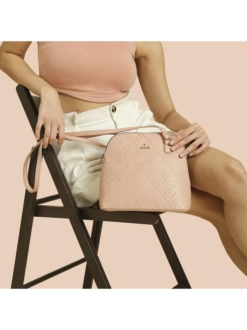 lavie debossed merlin pink synthetic textured sling handbag