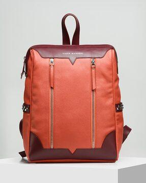 leather backpack with metal accent