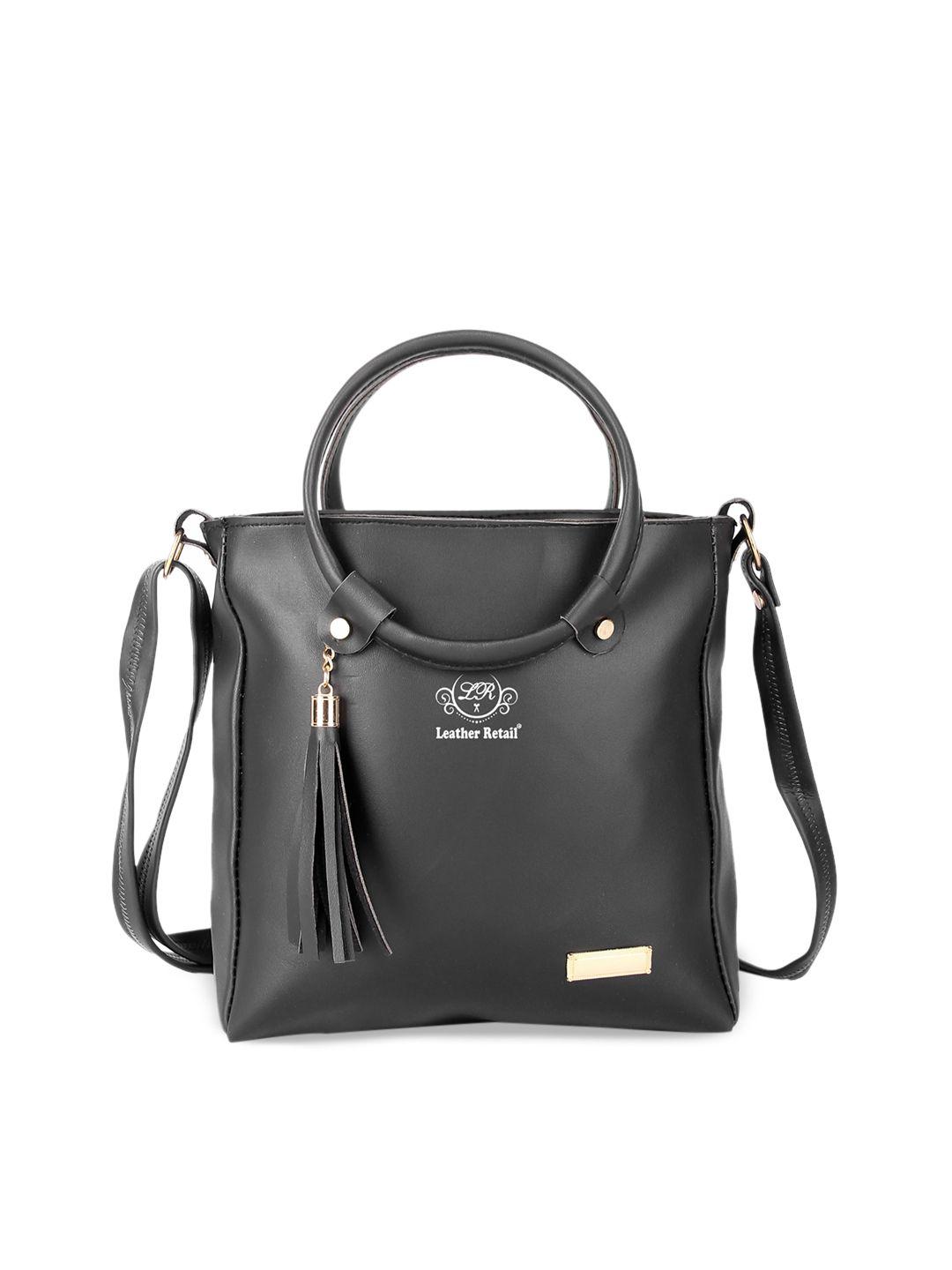 leather retail black pu structured handheld bag with tasselled