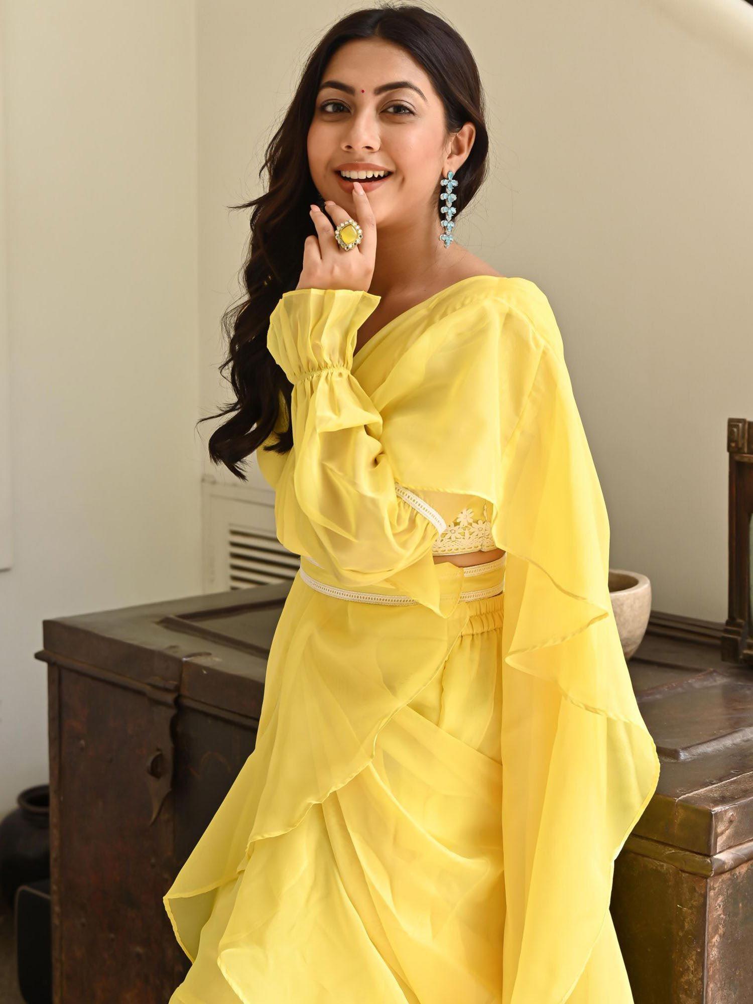 lemon yellow ruffle saree with stitched blouse