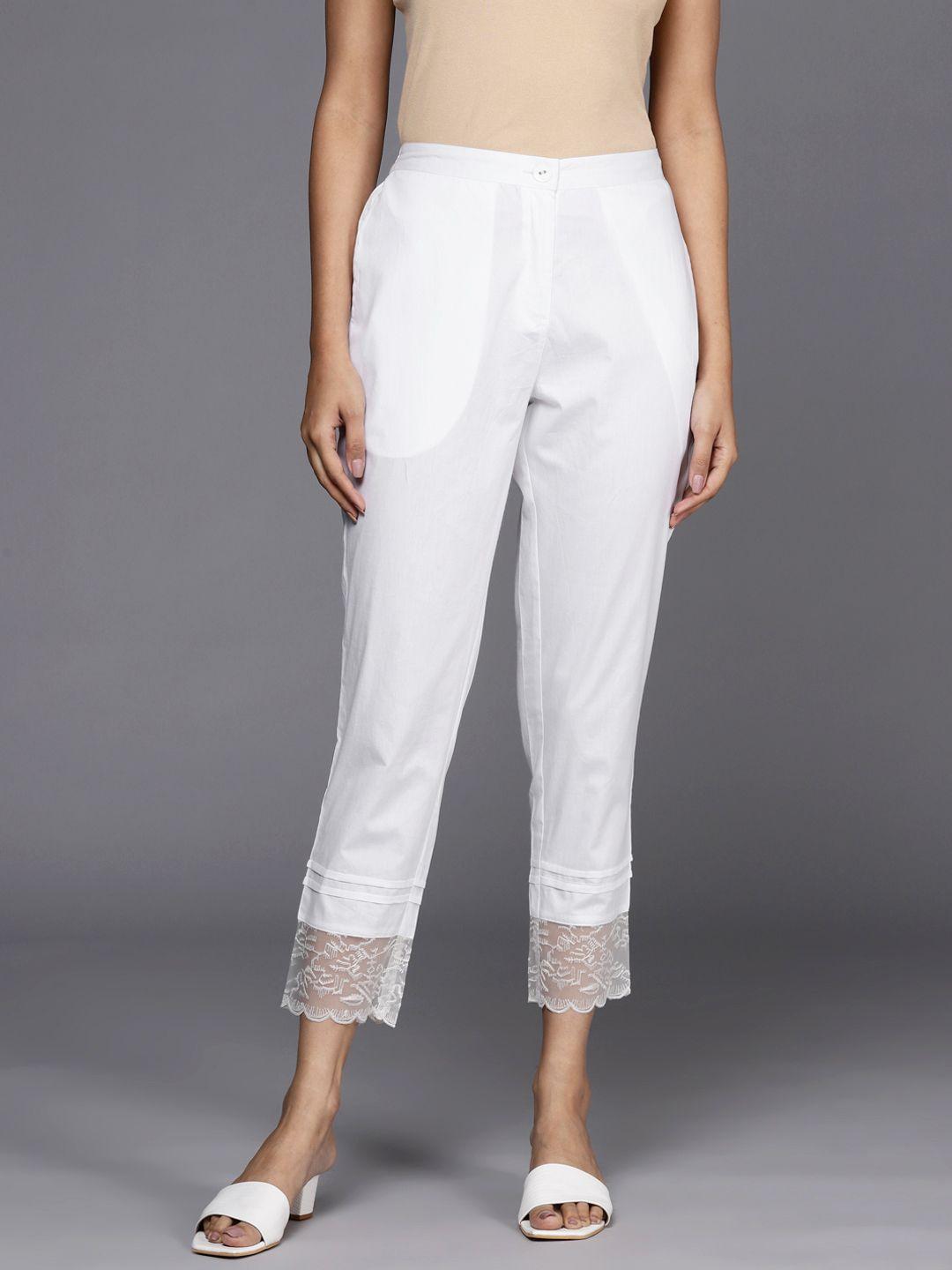 libas women white solid pure cotton trousers with lace inserts