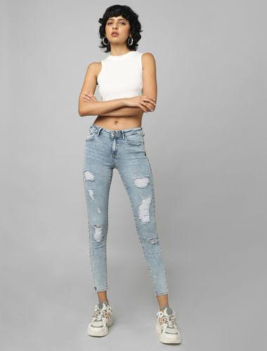 light blue mid rise distressed skinny jeans