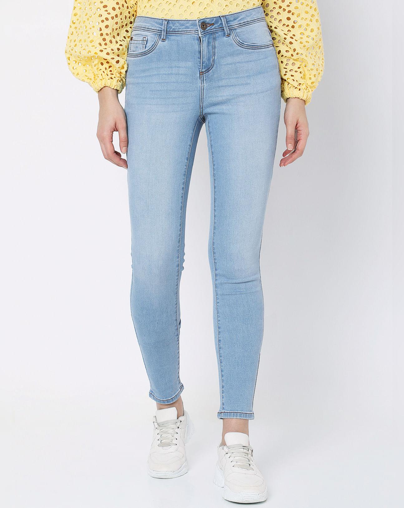 light blue mid rise skinny jeans