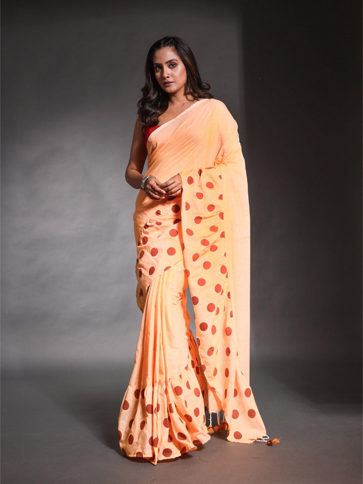 light orange pure cotton solid ruffle saree with unstitched blouse