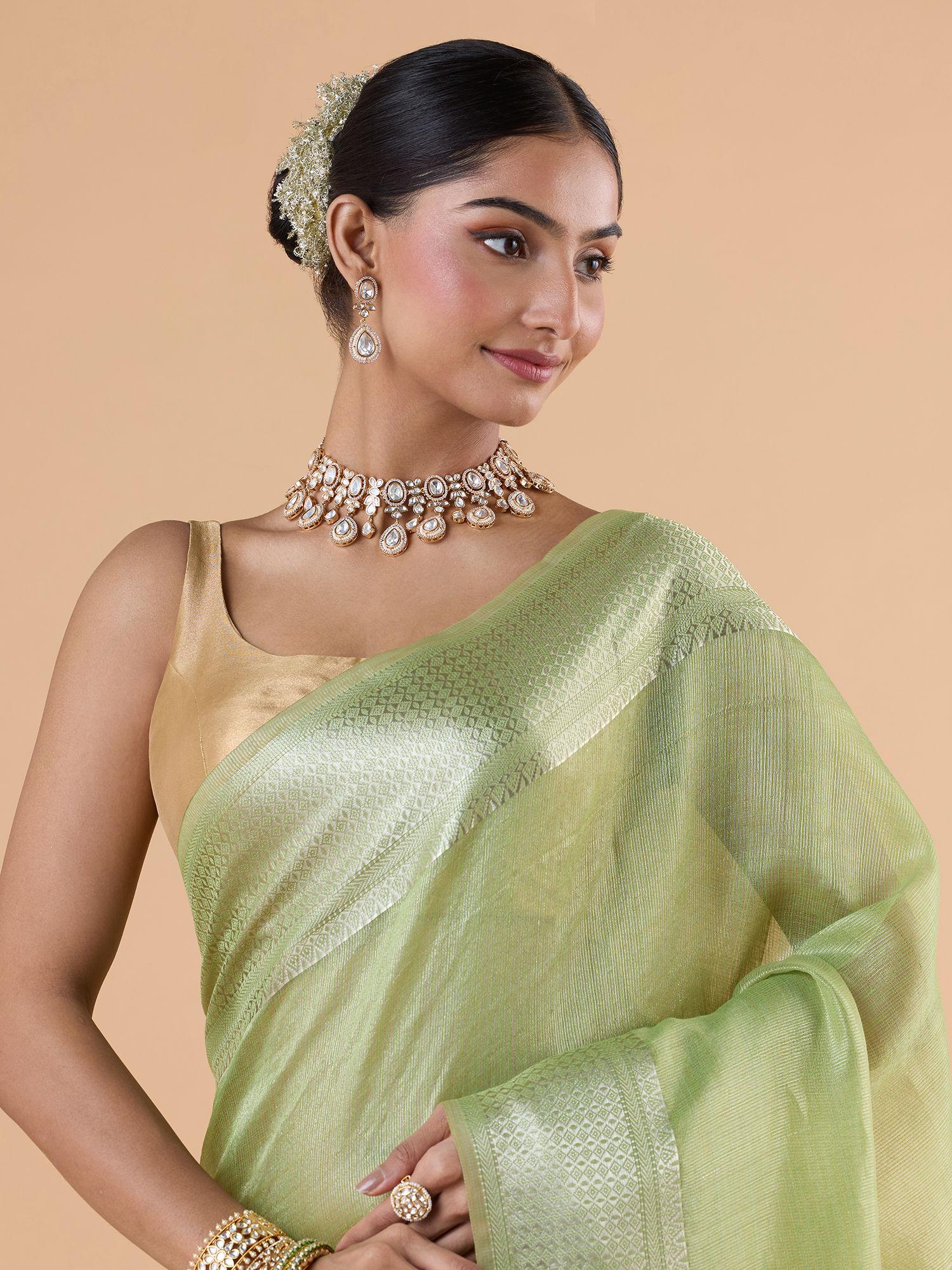 light organza green with silver woven border with stripes pallu saree with unstitched blouse