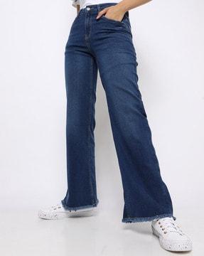 light-wash flared jeans with frayed hems