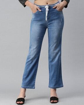 light-wash distressed jeans