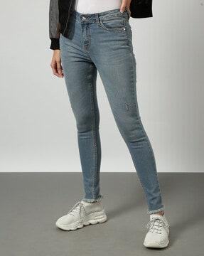 light-wash distressed skinny fit jeans