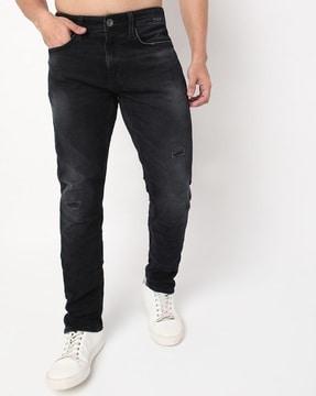 light-wash distressed slim fit jeans