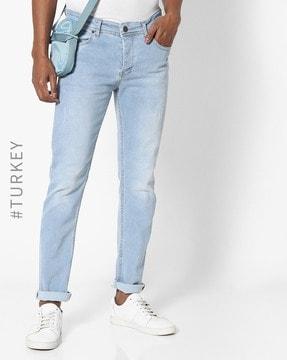 light-wash distressed straight fit jeans