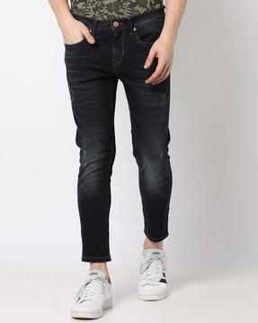 lightly washed & distressed slim fit jeans