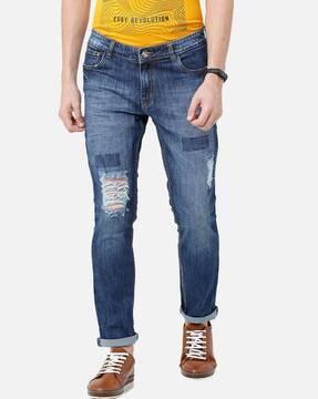 lightly washed distressed slim fit jeans