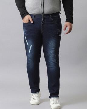 lightly washed distressed slim jeans