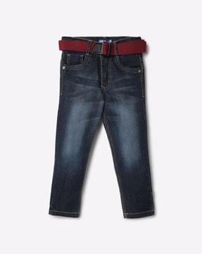 lightly washed jeans with fabric belt