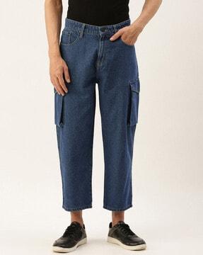lightly washed relaxed jeans with flap pockets