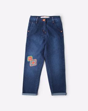 lightly washed slim fit jeans with crochet patches