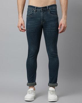 lightly washed slim jeans with insert pockets