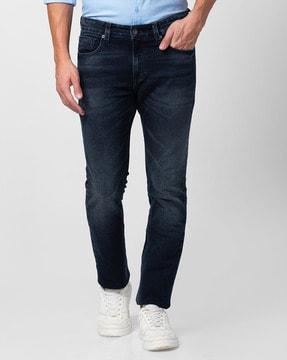 lightly-washed relaxed fit jeans