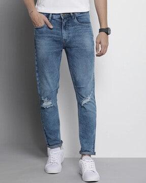 lightly washed & distressed slim fit jeans