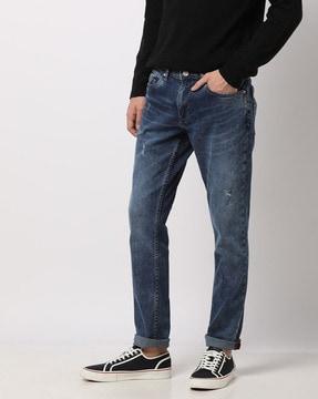 lightly washed & distressed slim fit jeans