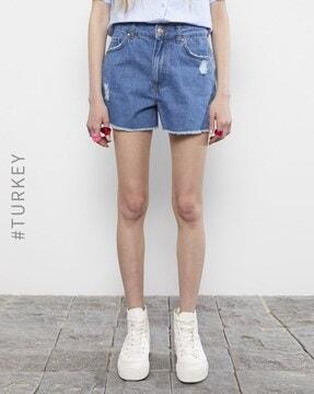 lightly washed distressed denim shorts