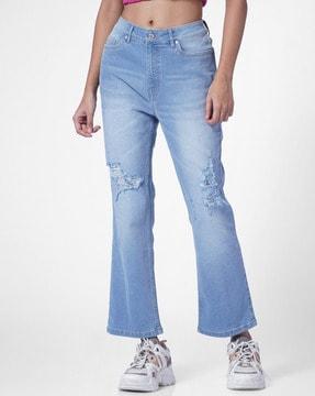 lightly washed distressed flared jeans
