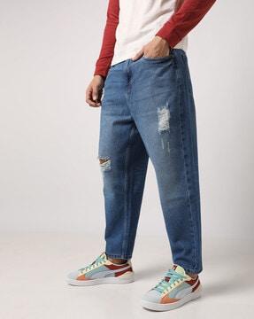 lightly washed distressed relaxed jeans