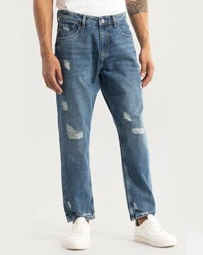 lightly washed distressed relaxed jeans