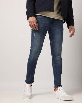 lightly washed distressed skinny fit jeans