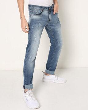 lightly washed distressed slim fit jeans