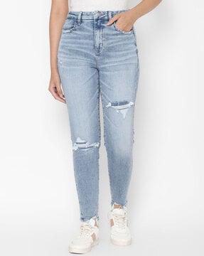 lightly washed distressed slim fit jeans