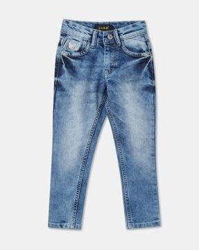 lightly washed distressed slim fit jeans