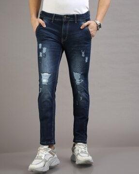 lightly washed distressed slim fit jeans