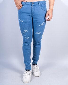 lightly washed distressed slim jeans