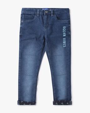 lightly washed jeans with placement print