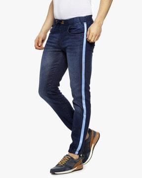 lightly washed jogger jeans with contrast stripes