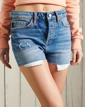 lightly washed mid-rise distressed skinny shorts