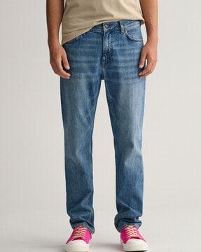 lightly-washed mid-rise jeans