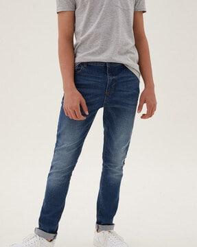 lightly-washed mid-rise skinny jeans