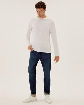 lightly washed mid-rise tapered jeans